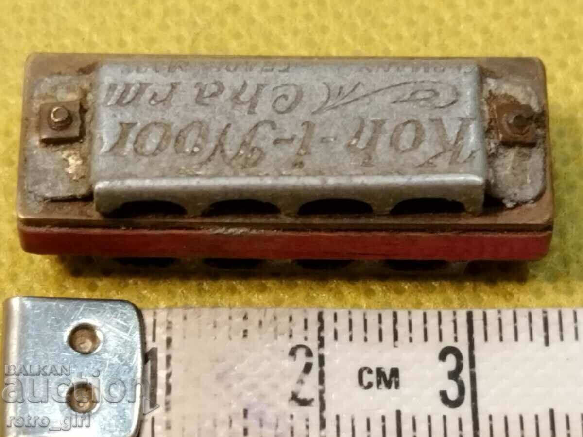 A very small branded harmonica. - 5 A very small branded harmonica. - 5
