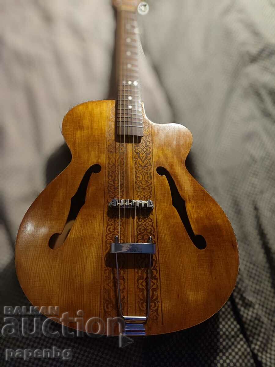 Old BG Gibson guitar. Restored, with engraving.