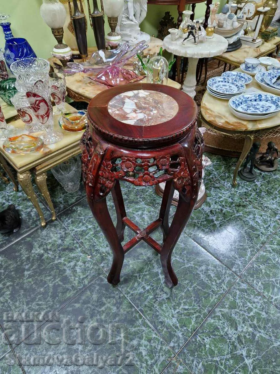 A lovely antique wooden coffee table with a marble top