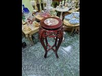 A lovely antique wooden coffee table with a marble top