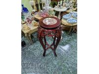 A lovely antique wooden coffee table with a marble top