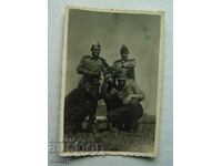 A small old photo - soldiers with a donkey