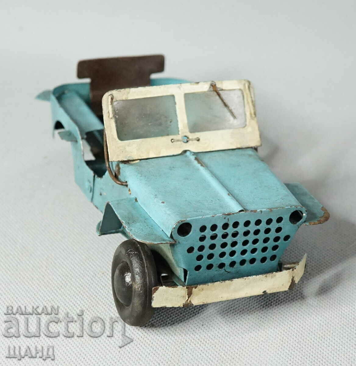 Old metal sheet metal toy jeep model