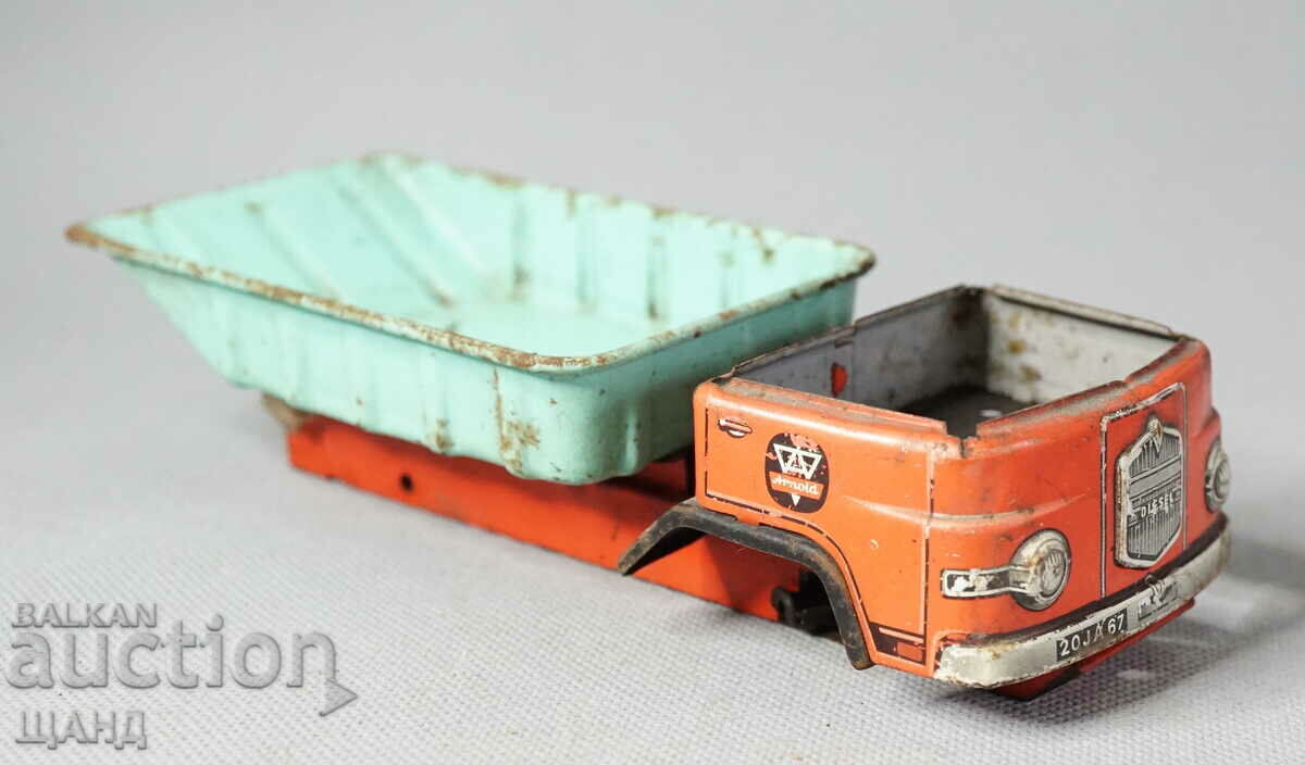 Old metal sheet metal toy dump truck model