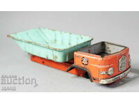 Old metal sheet metal toy dump truck model