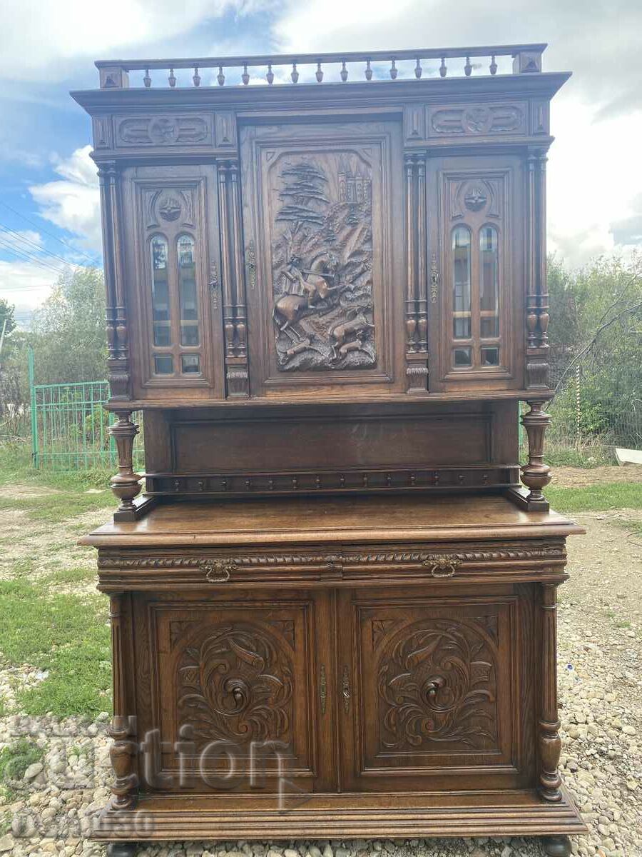 A beautiful massive wooden cabinet with a unique relief carving