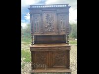 A beautiful massive wooden cabinet with a unique relief carving