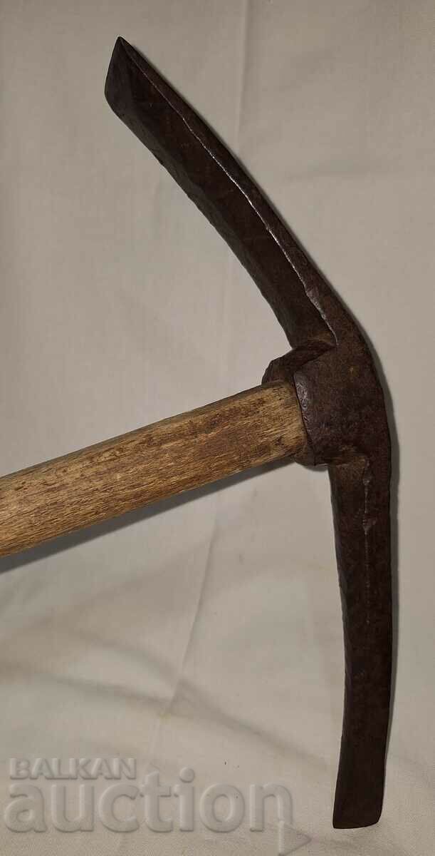 Old hand forged instrument with engravings Old hand forged instrument with engravings