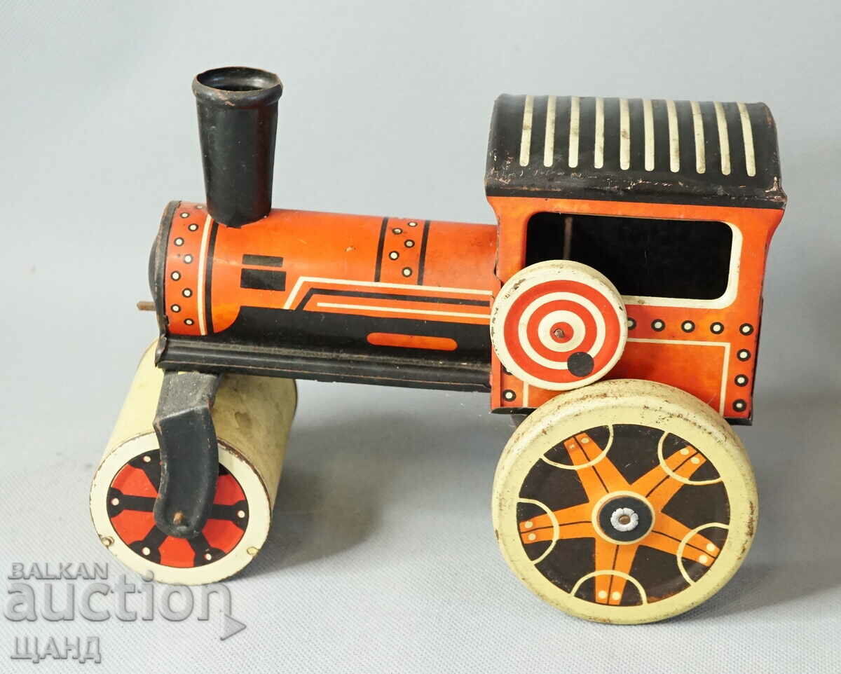 Old metal mechanical toy roller model