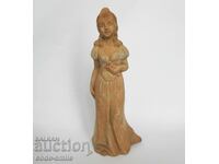 Old ceramic statuette figure of a young lady