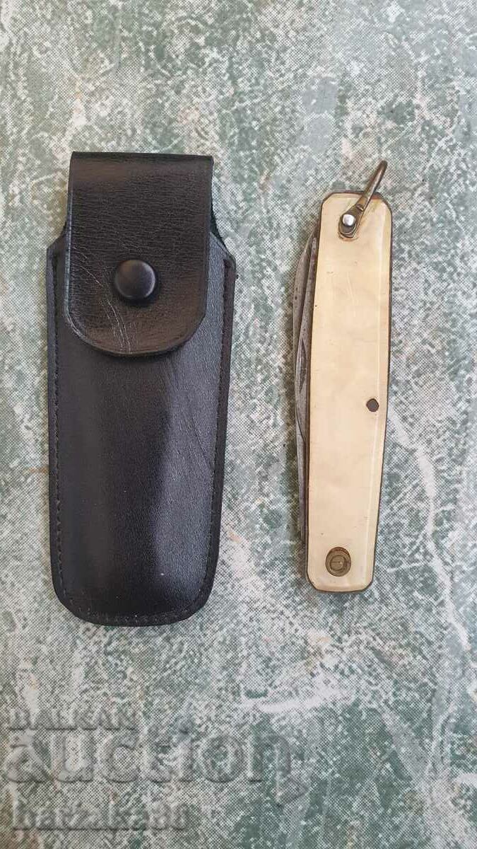 Old white pocket knife with case