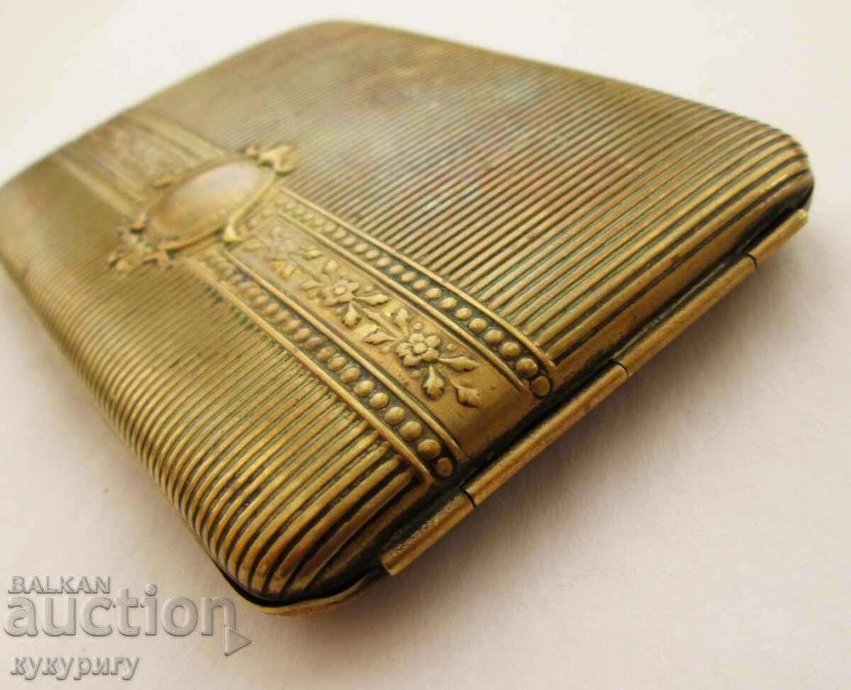 Old cigarette case with green stone on the button with price 60.00 BGN | € 30.68 Old cigarette case with green stone on the button with price 60.00 BGN | € 30.68
