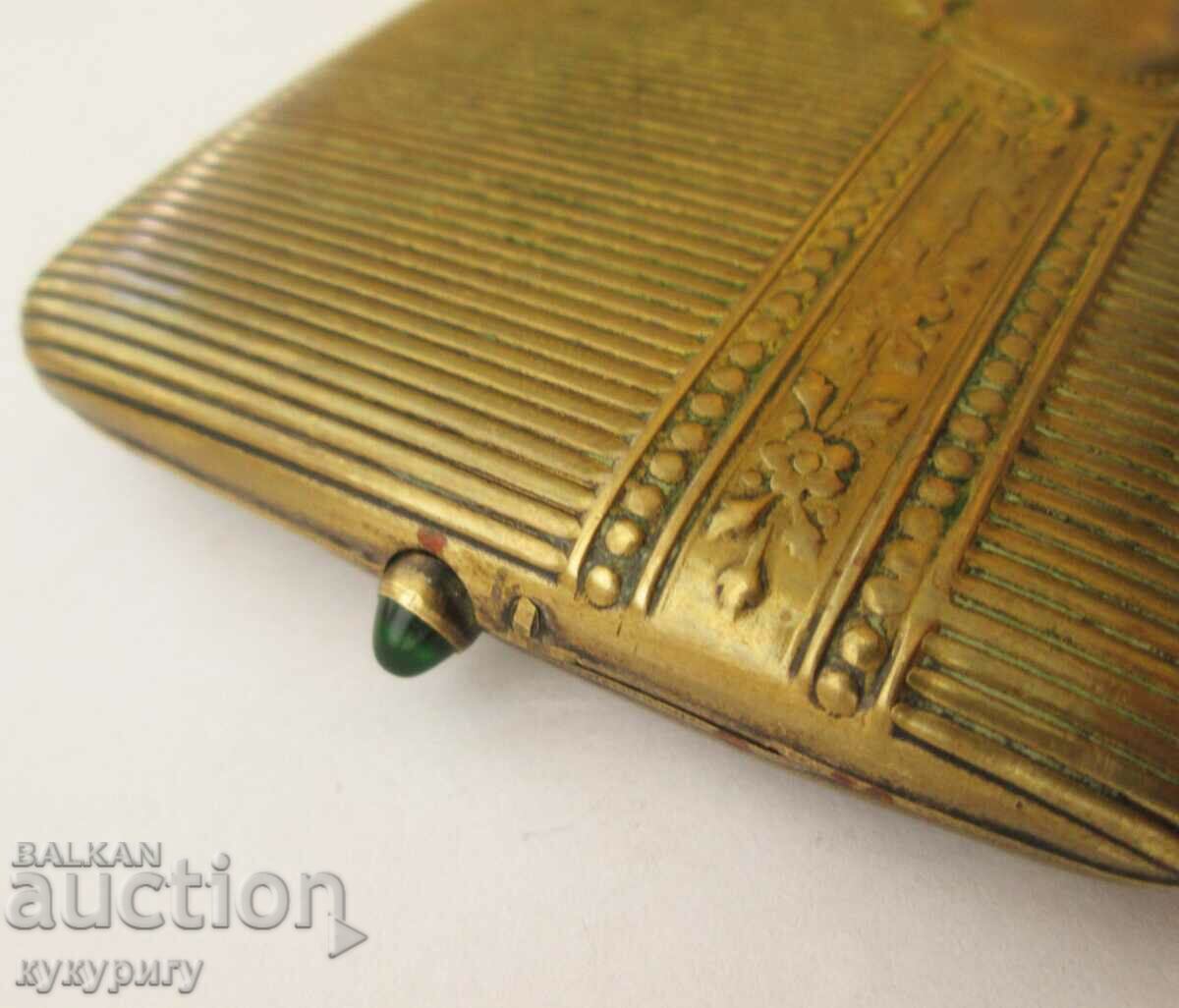 Delivery of Old cigarette case with green stone on the button Delivery of Old cigarette case with green stone on the button