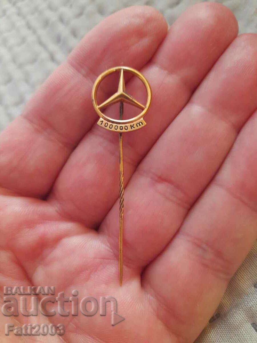 Silver Mercedes badge