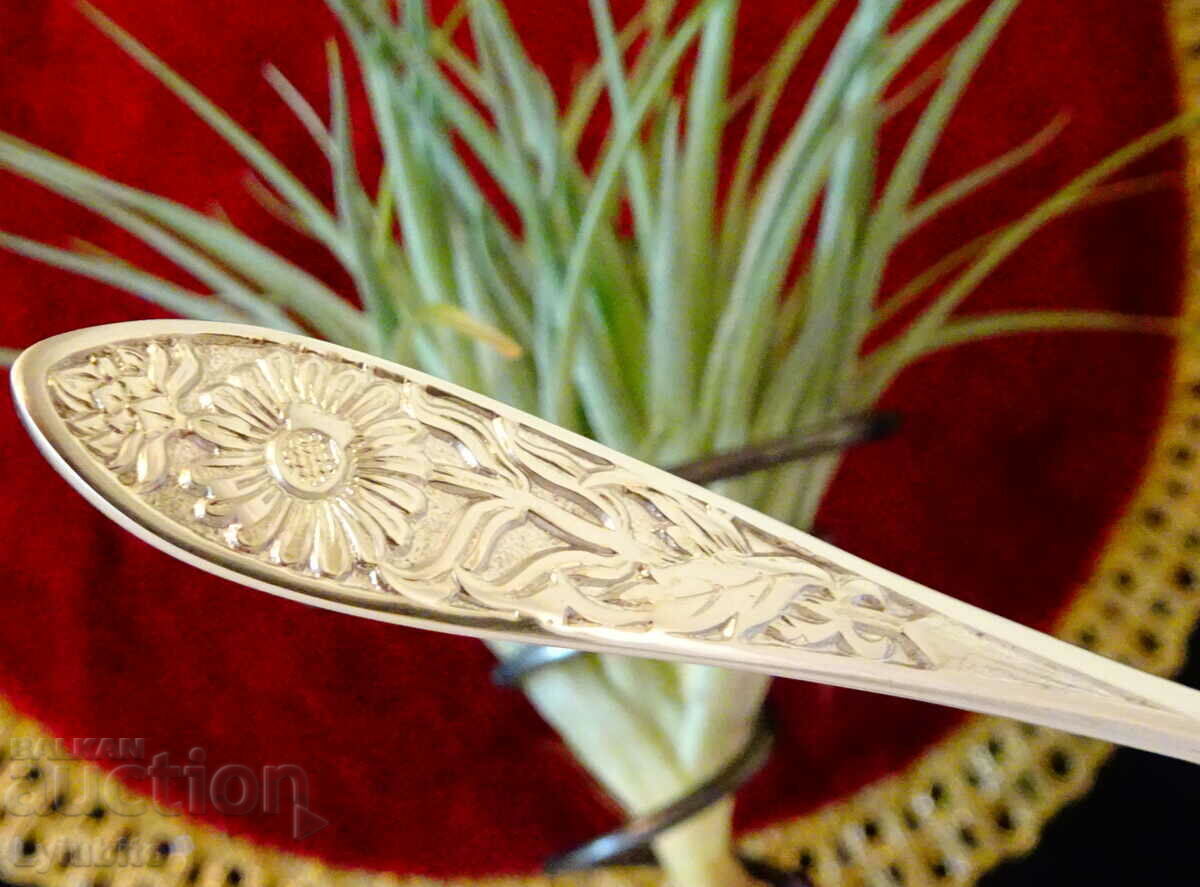 Auction  Silver-plated spoon, embossed flowers.