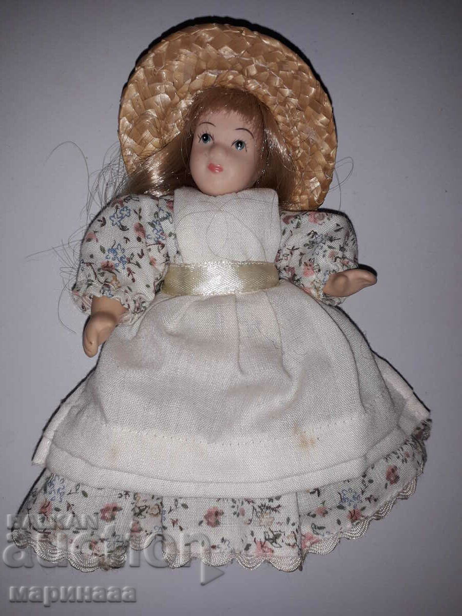 A DOLL. COLLECTION. PORCELAIN