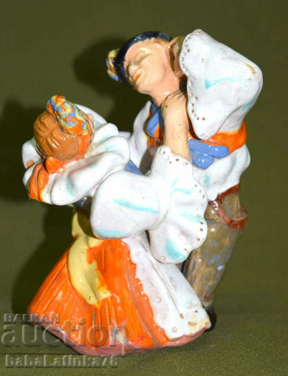 A beautiful porcelain figurine of a dancing couple