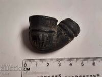 A very old ceramic, clay pipe