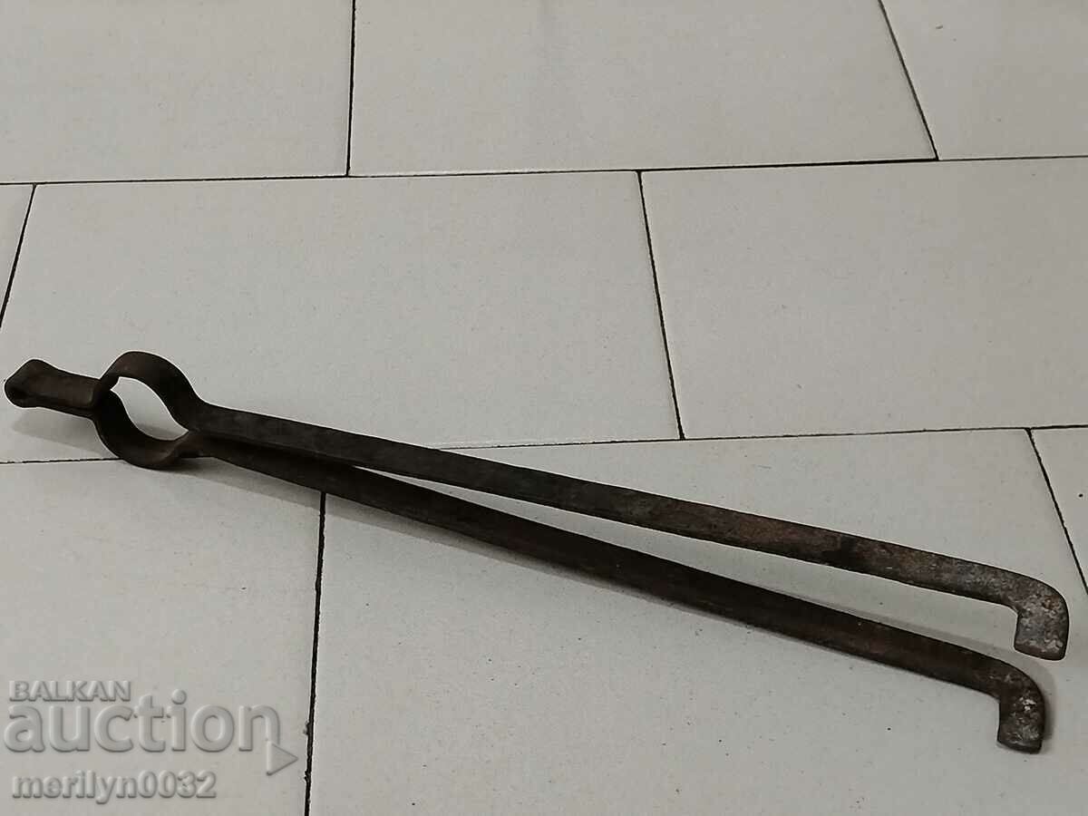 Auction Old hand-forged dilaf, wrought iron, tongs Auction Old hand-forged dilaf, wrought iron, tongs