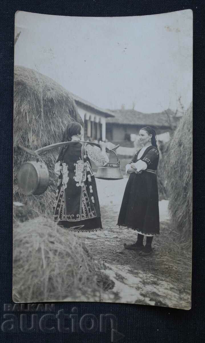 Menci women in folk costumes