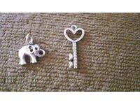 LOT OF TWO SILVER ELEPHANT AND HEART KEY PENDANTS WITH STONES