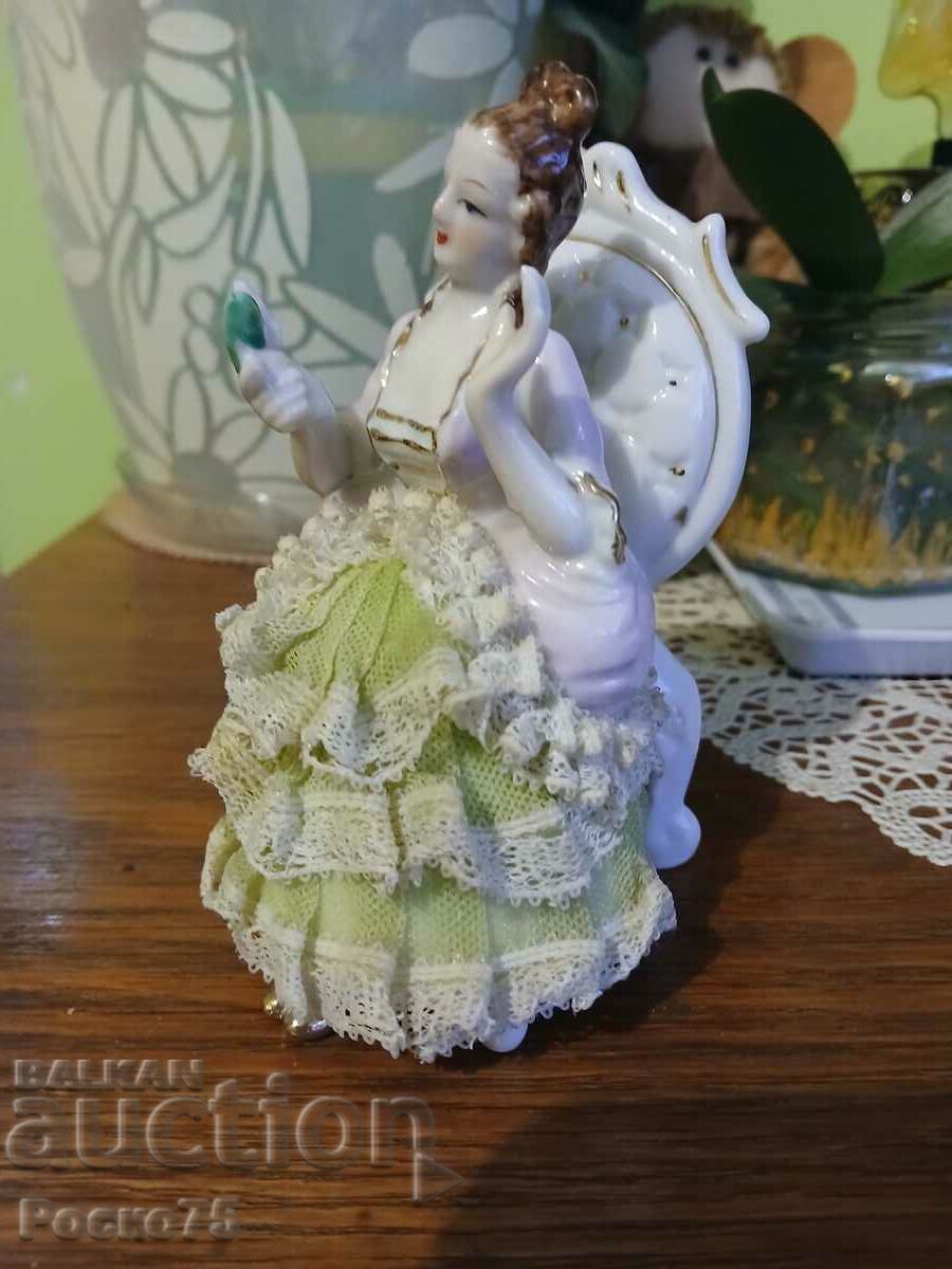 Porcelain vintage lady with flower figure