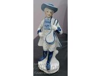 Marked porcelain statuette