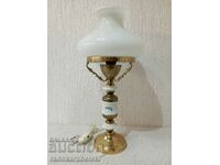 A beautiful vintage lamp with a white glass shade