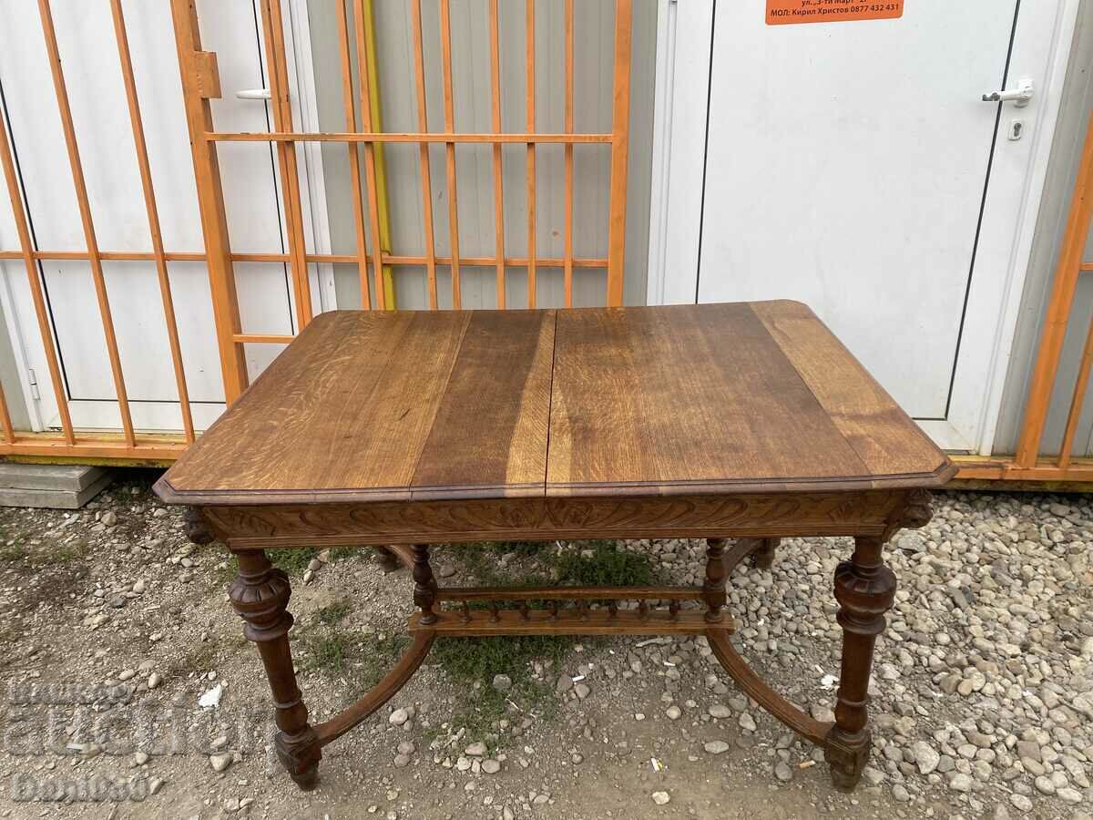 A unique solid oak table with beautiful carving