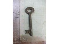 Old bronze key for a lock