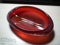 Colored red glass ashtray