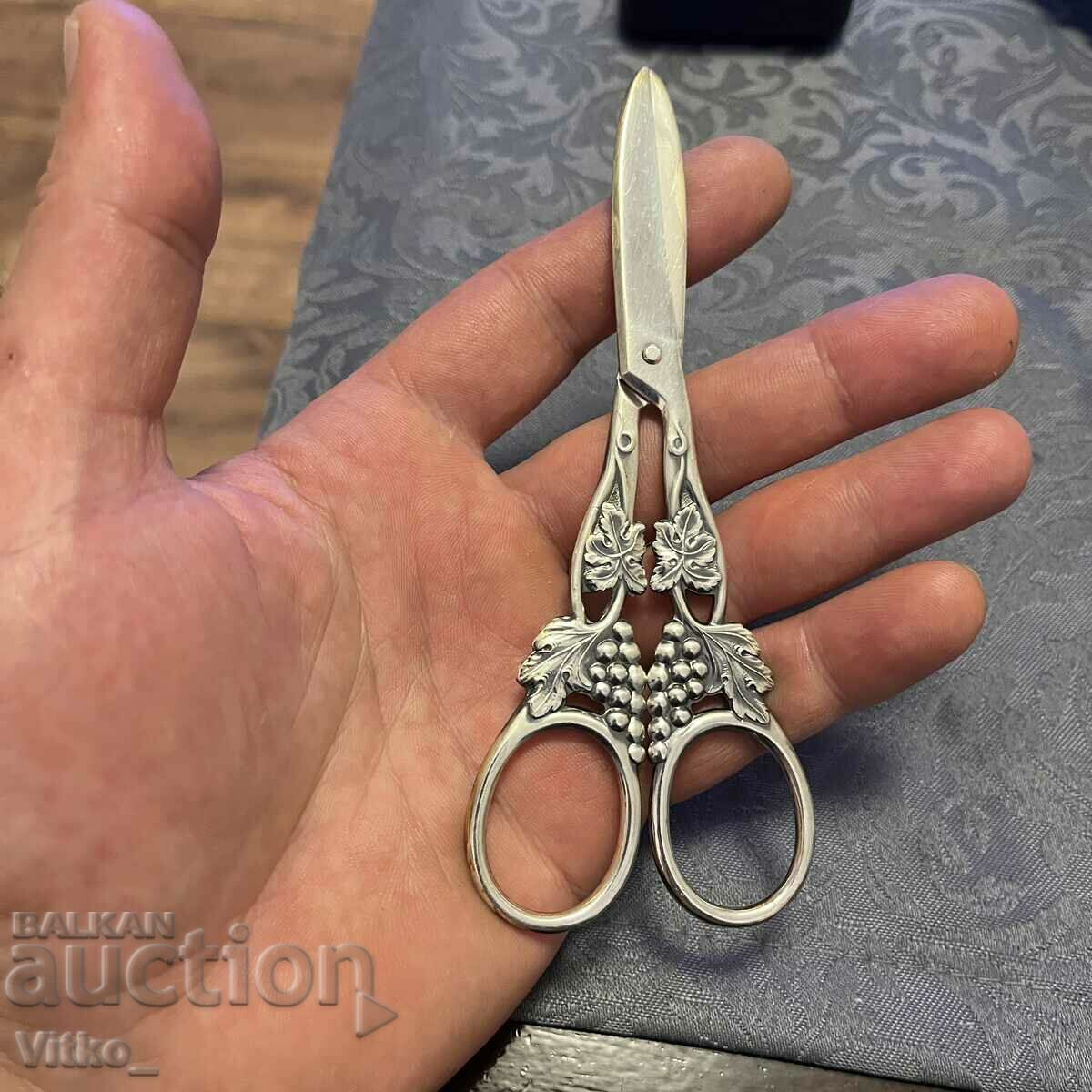 Silver scissors, markings