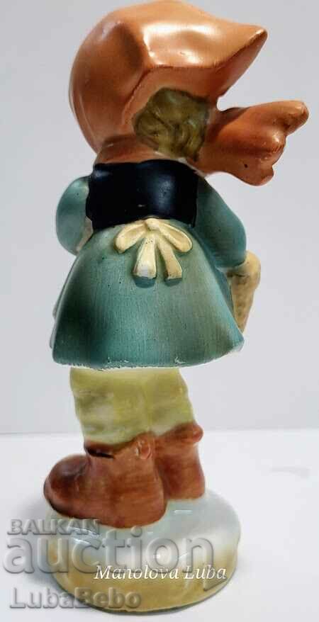 Delivery of Hummel style girl figurine. Delivery of Hummel style girl figurine.