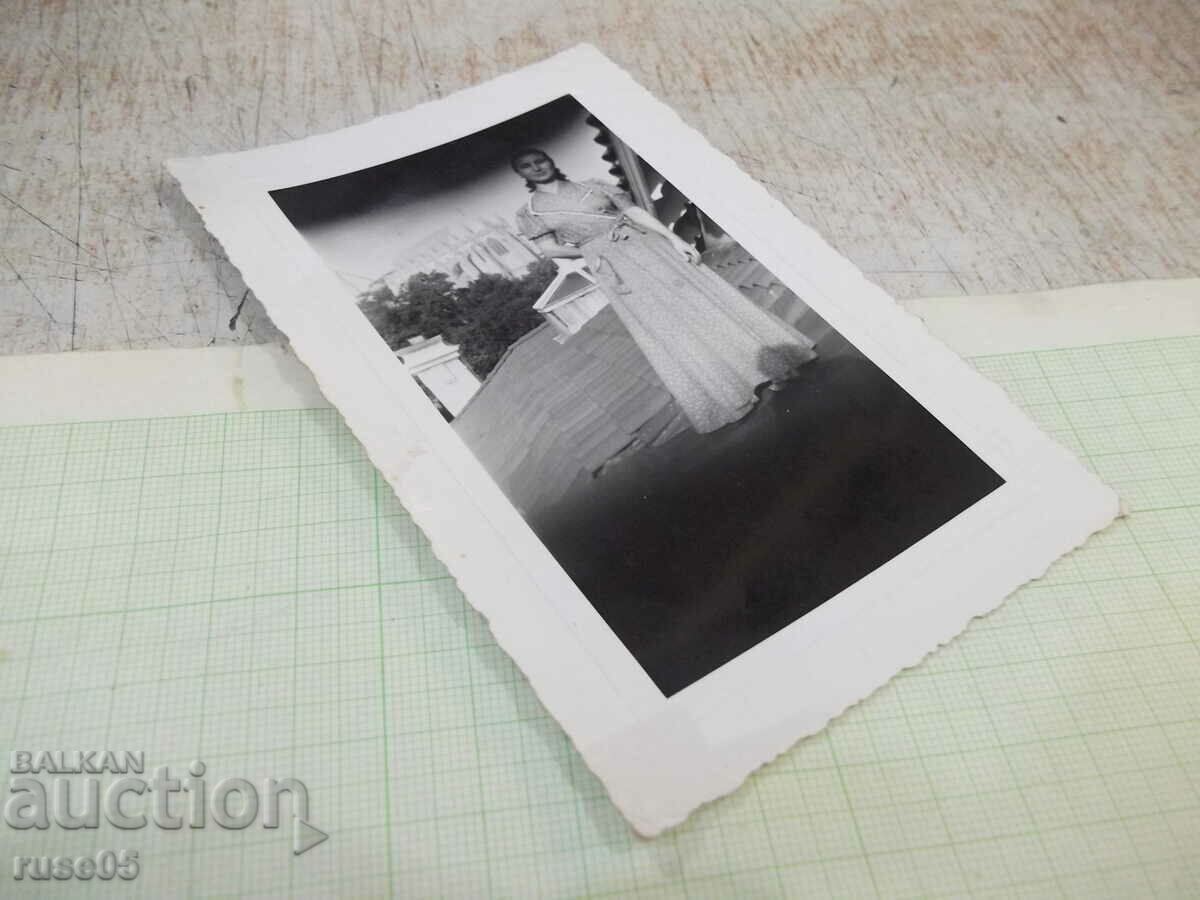 Auction Old photo of a woman on a roof Auction Old photo of a woman on a roof