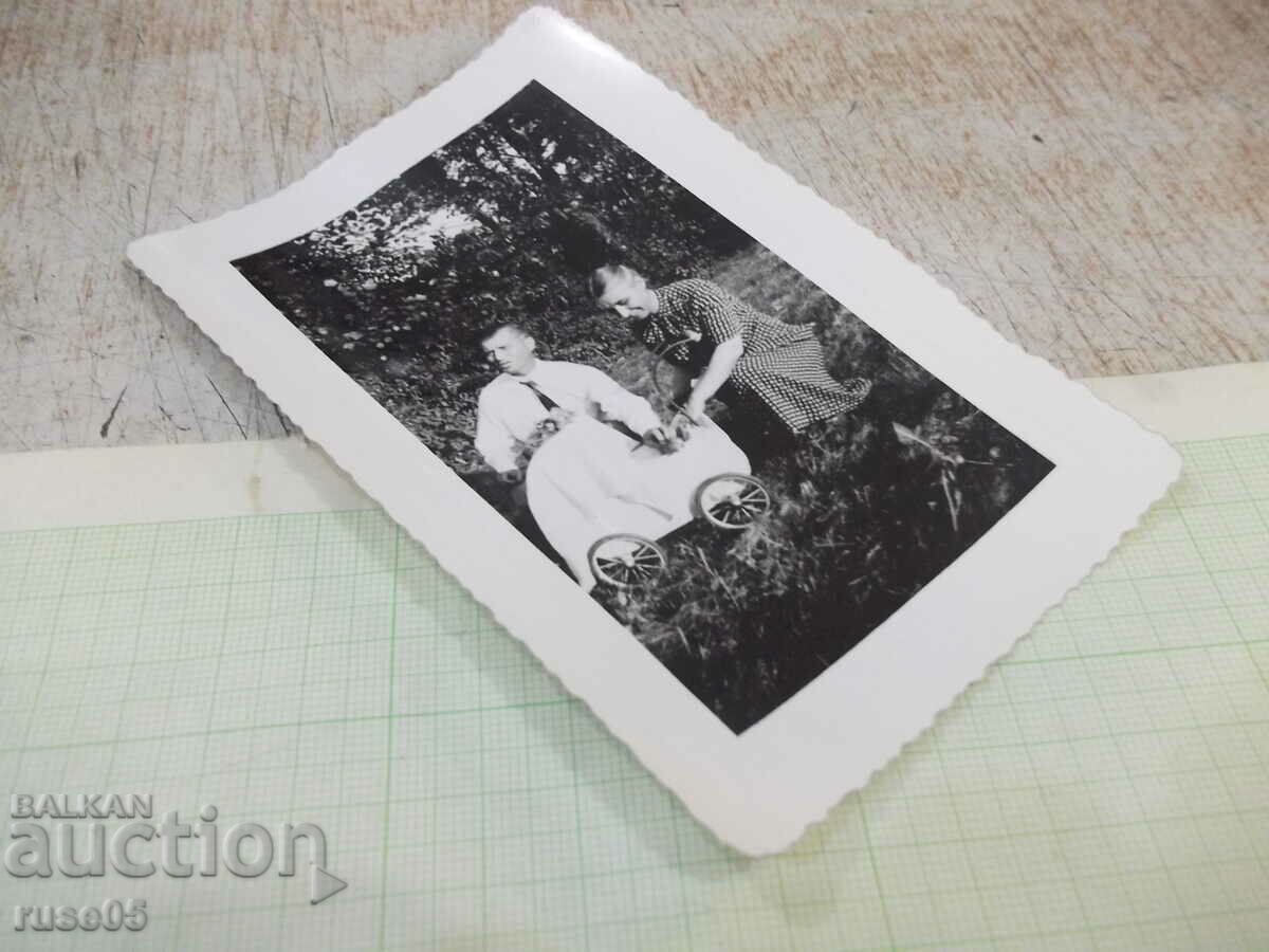 Auction Old photo of a family with a pram in the park Auction Old photo of a family with a pram in the park