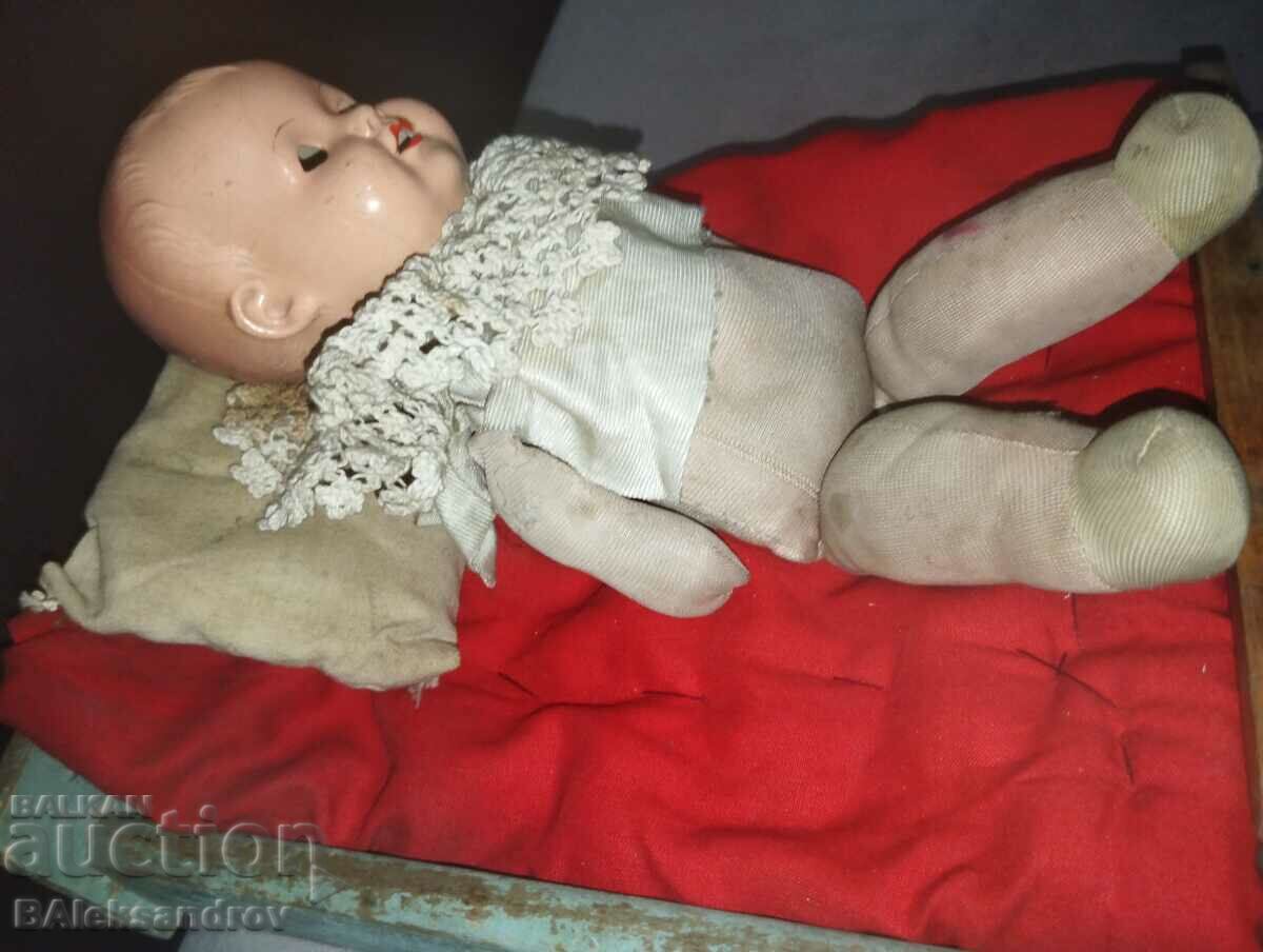 Auction Old baby doll with bed Auction Old baby doll with bed