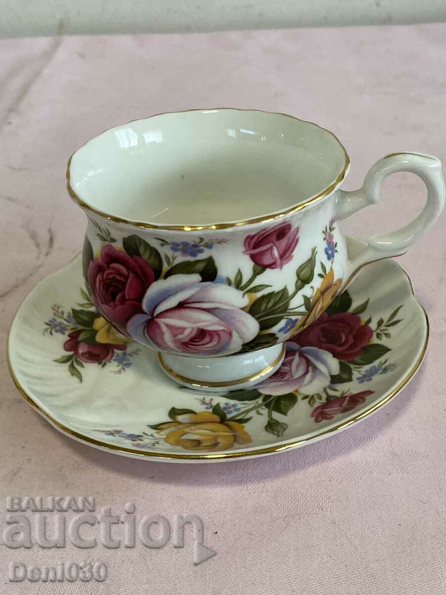 A beautiful English porcelain coffee cup with markings