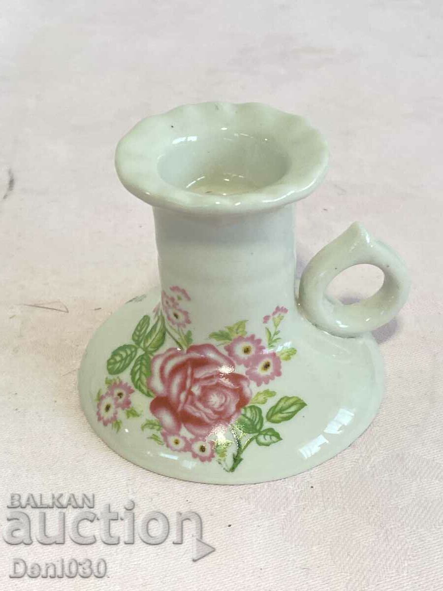 A beautiful porcelain candlestick with markings