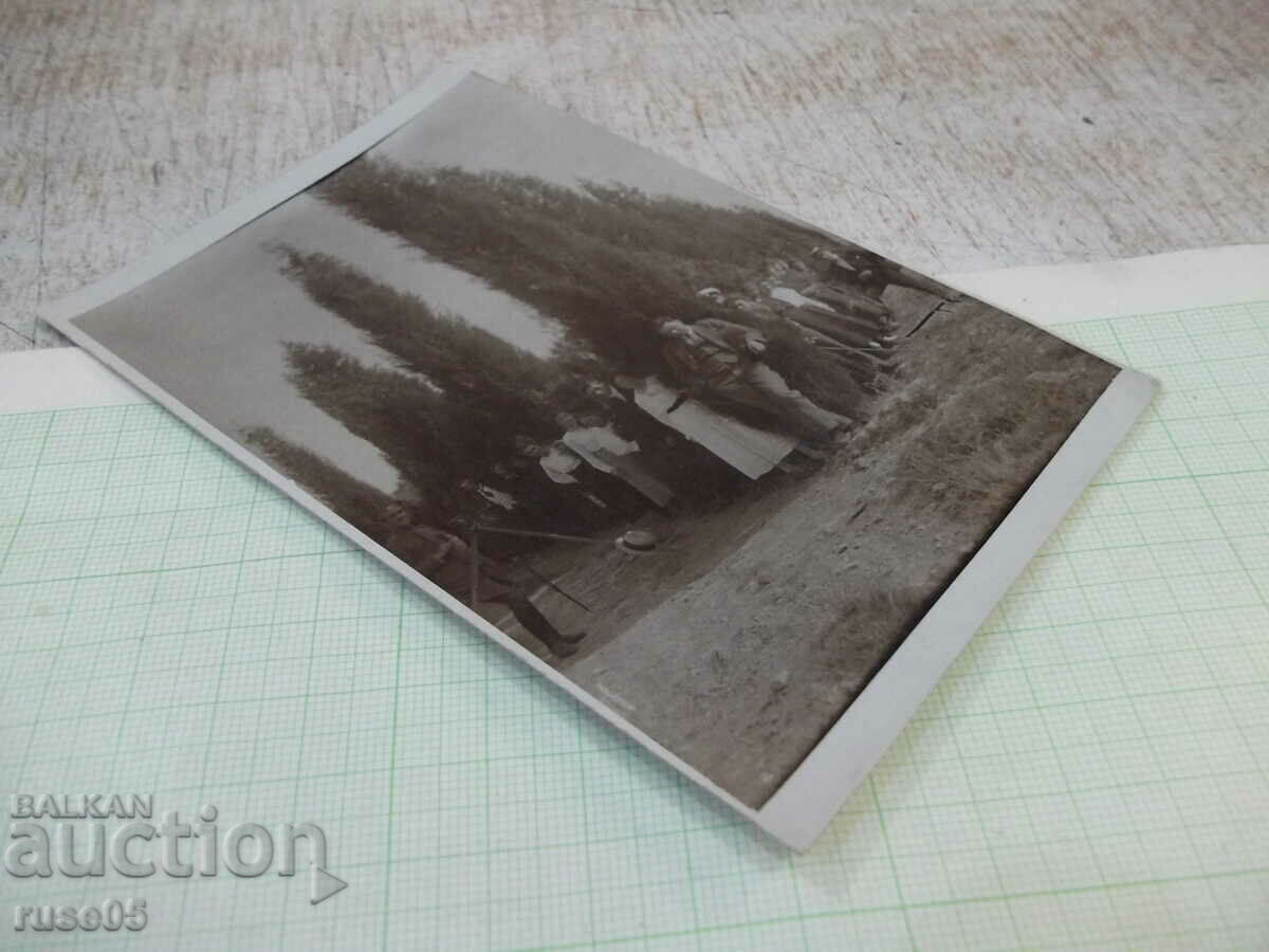 Auction  Old photo in front of the trees