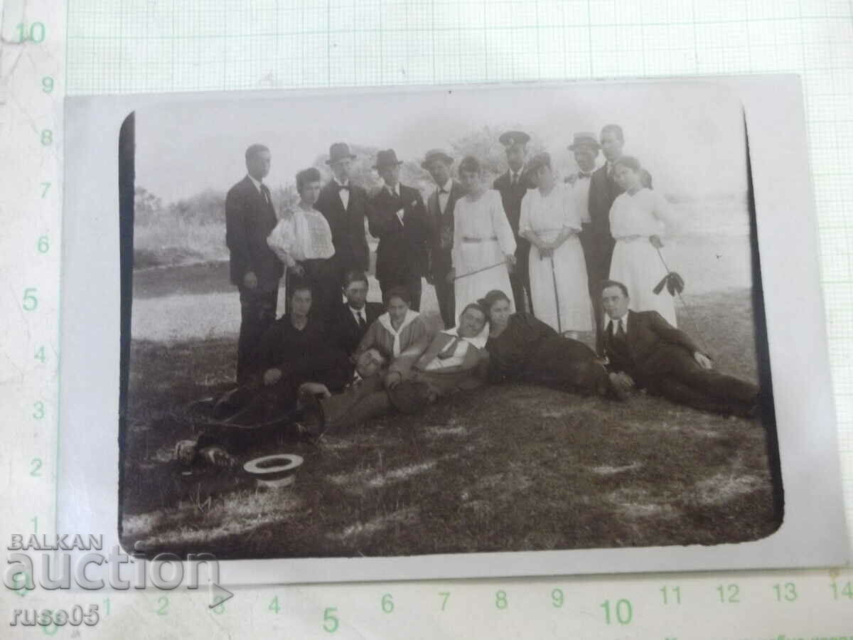 An old photo of a group of gentlemen and ladies