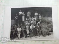 Old photo of a group of young people in nature