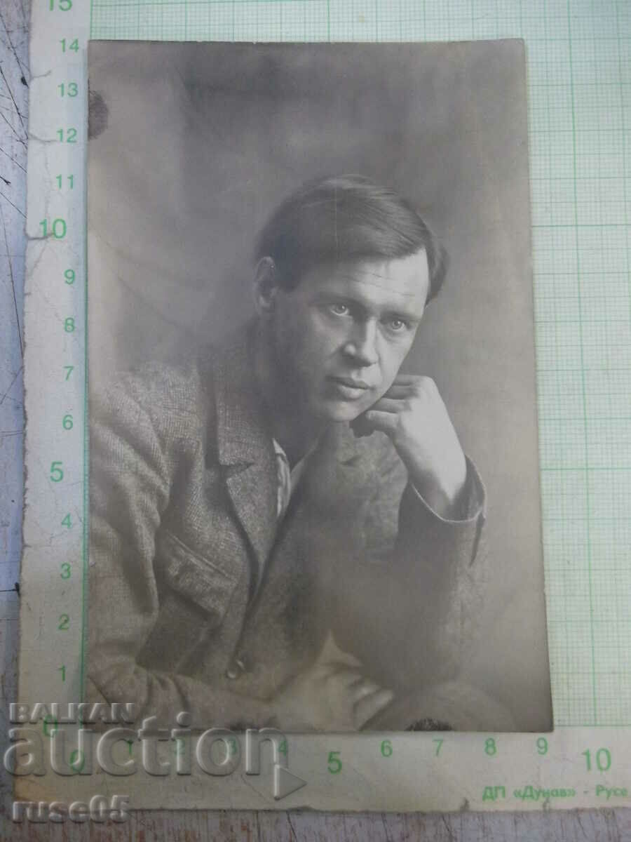 An old photo of a gentleman with a poem next to his beloved