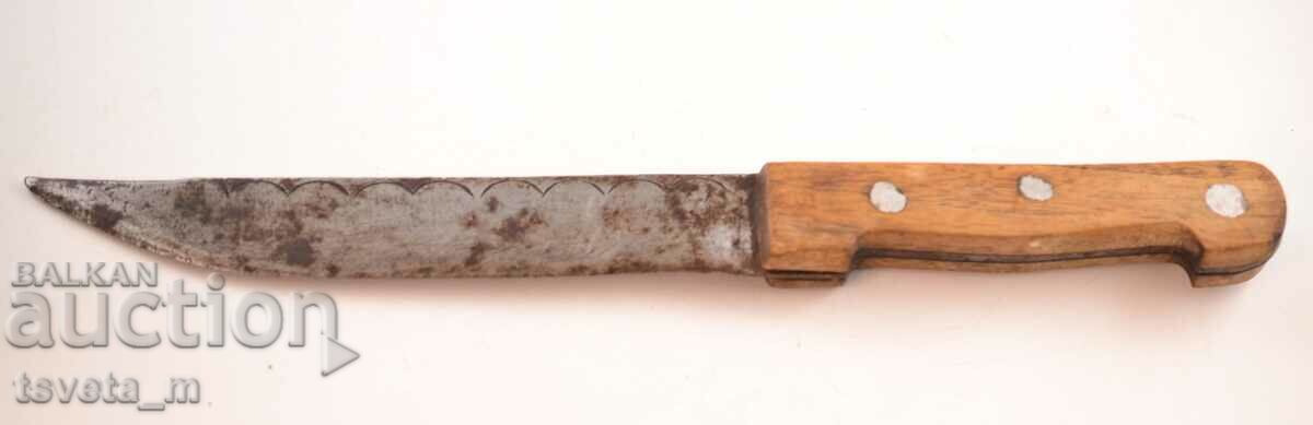 Antique knife with a wooden handle