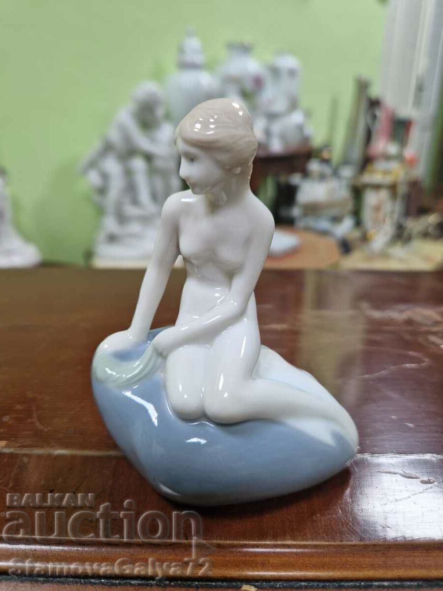 Auction  A rare antique Royal Copenhagen porcelain figure