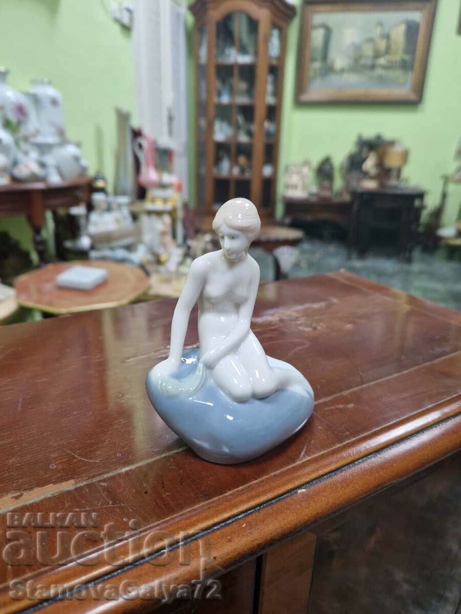 Delivery of A rare antique Royal Copenhagen porcelain figure