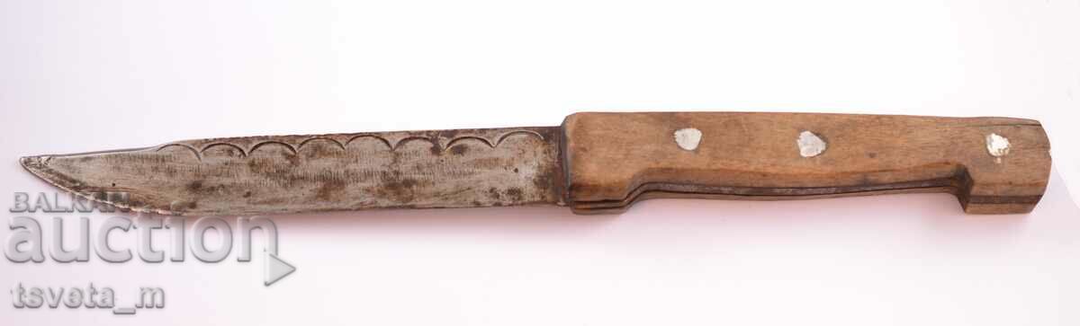 Antique knife with a wooden handle