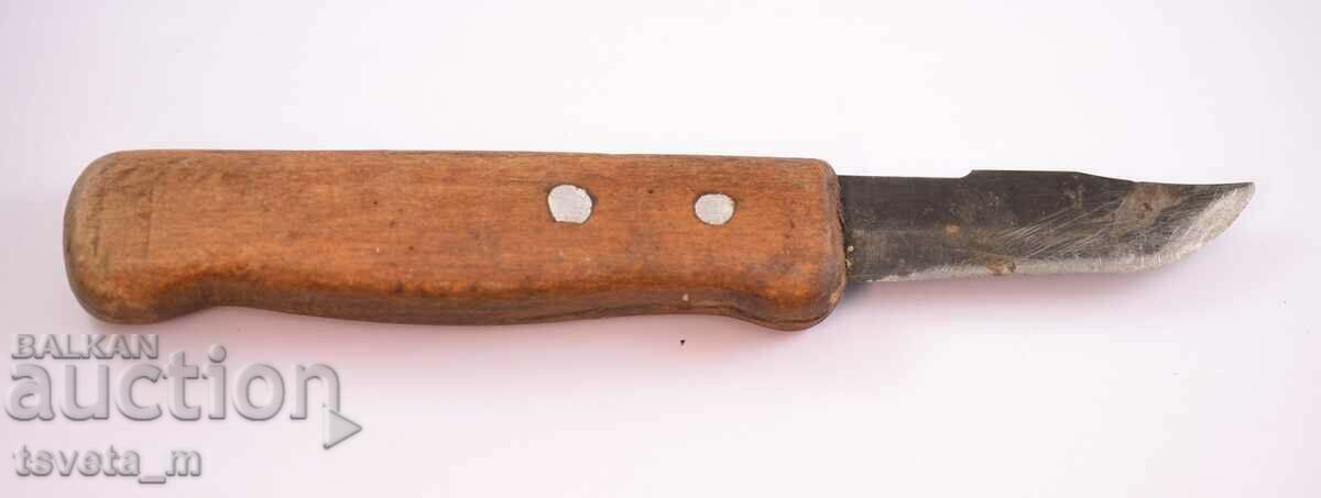 Antique knife with a wooden handle