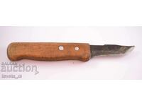 Antique knife with a wooden handle