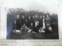 Old photo of women with children outing in the garden