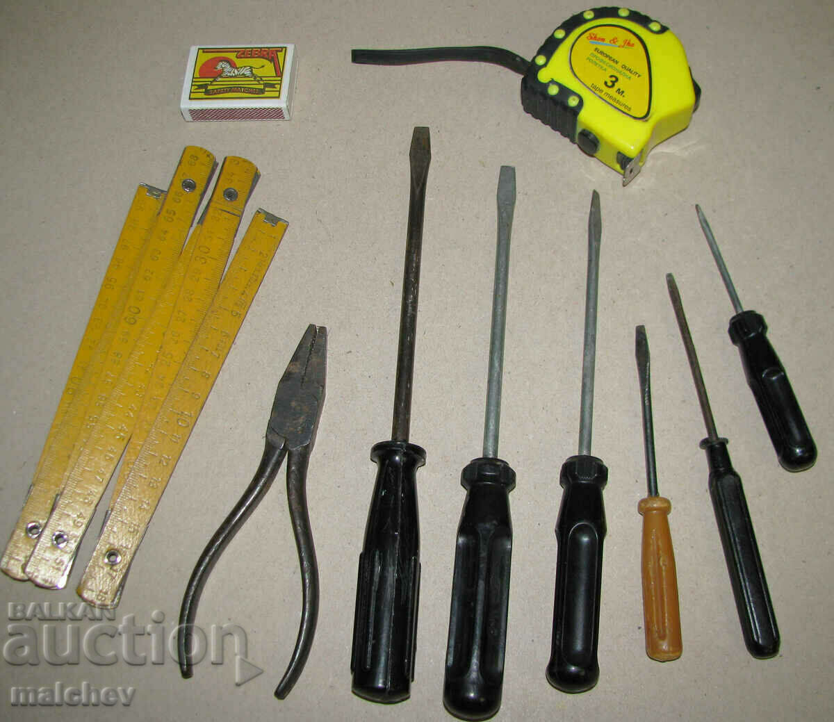 Lot of tools straight screwdrivers pliers tape measure saved